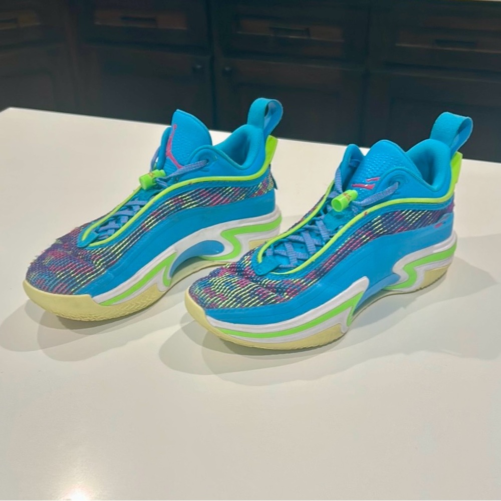 Nike Jordan Luka Blue and Green Athletic Shoes with Streamlined Design.